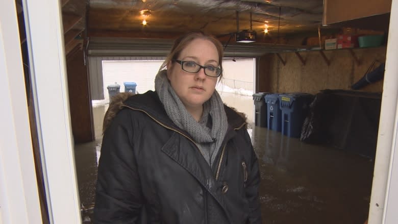 Homeowner says 9 days for city to respond to flooded back lane unacceptable