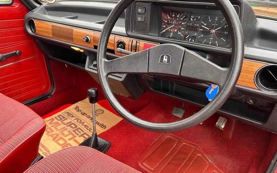 Inside the car, view of the steering wheel and dash