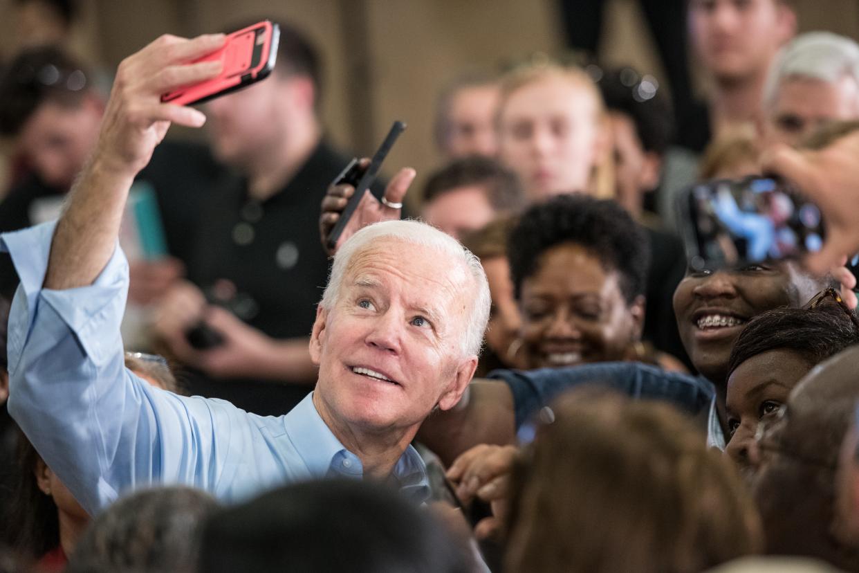 Then-Democratic presidential candidate Joe Biden takes photos with people in the crowd at a campaign event at the Hyatt Park community center on May 4, 2019 in Columbia, South Carolina. It was Biden's first visit to South Carolina as a 2020 presidential candidate.