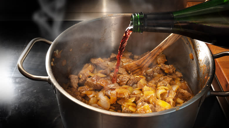 Alcohol being poured into pot