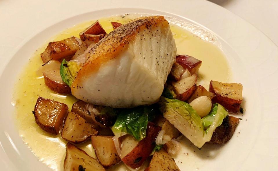 The Chilean sea bass entree with potatoes and Brussels sprouts at Sorrento.