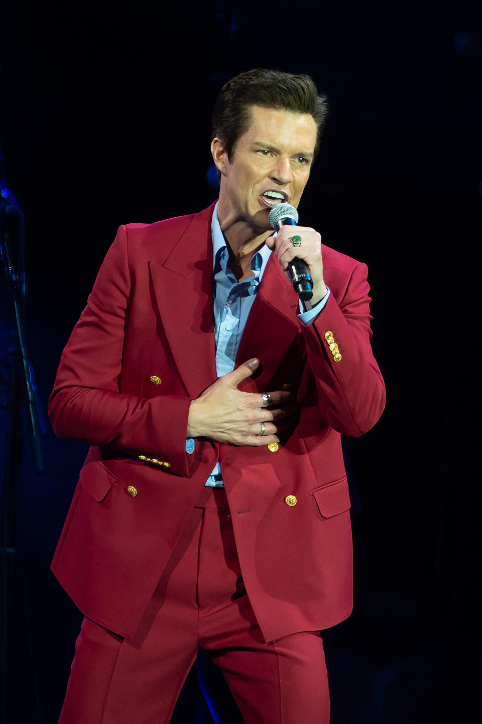 Brandon Flowers of the Killers performing in a suit