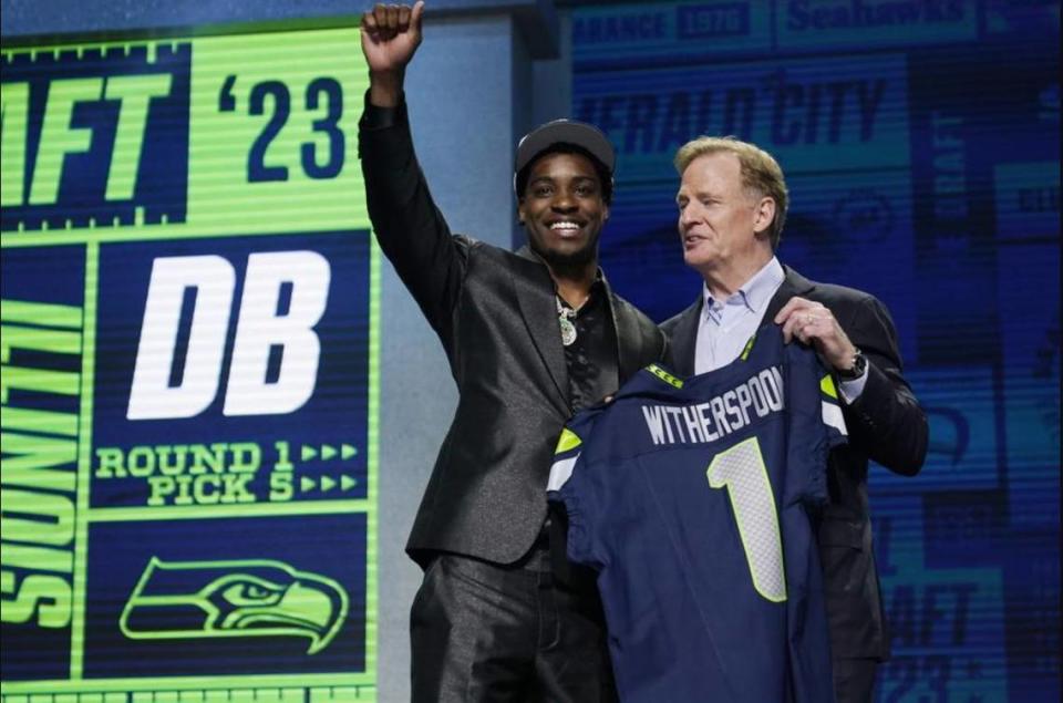 Devon Witherspoon, left, with commissioner Roger Goodell after the Seahawks made the cornerback from Illinois the fifth pick in the 2023 NFL draft April 27, 2023, in Kansas City, Missouri.