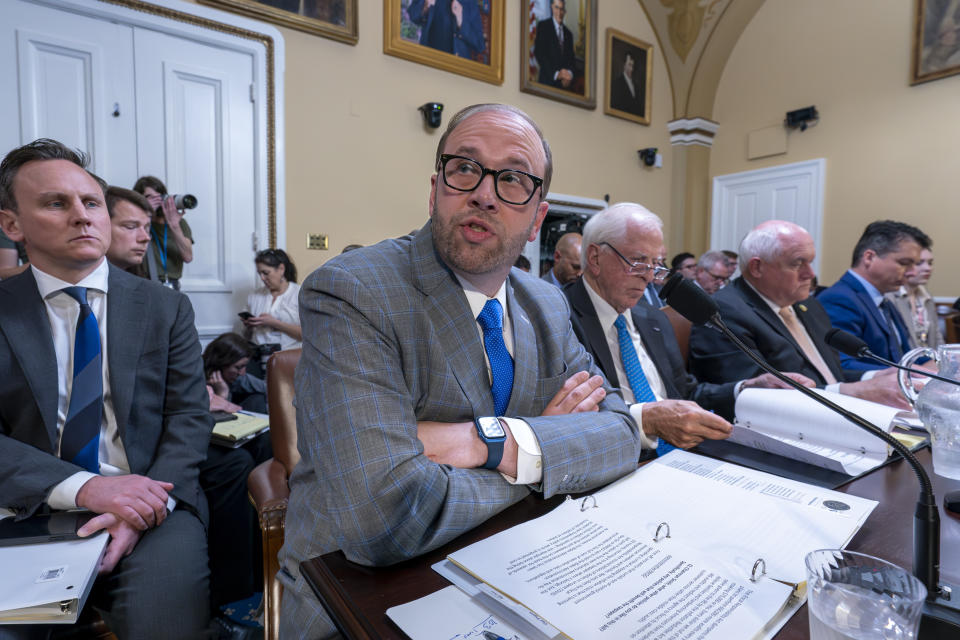 FILE - House Ways and Means Committee Chairman Jason Smith, R-Mo., testifies as the House Rules Committee prepared the debt limit bill, The Fiscal Responsibility Act of 2023, for a vote on the floor, at the Capitol in Washington, Tuesday, May 30, 2023. He is joined at right by Rep. Mike Thompson, D-Calif., Rep. Ron Estes, R-Kan., and Rep. Brendan Boyle, D-Pa. (AP Photo/J. Scott Applewhite, File)