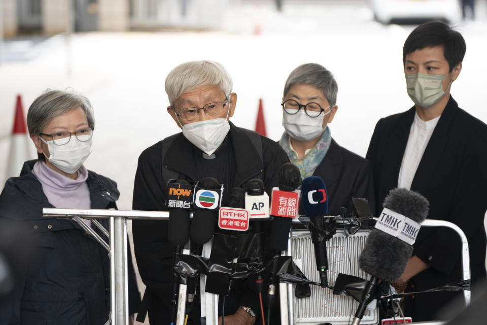 Cardinal Joseph Zen, second from left, speaks to members of the media at the West Kowloon Magistrates's Courts after the verdict session in Hong Kong, Friday Nov. 25, 2022. A 90-year-old Catholic cardinal and five others in Hong Kong were fined after being found guilty Friday of failing to register a now-defunct fund that aimed to help people arrested in the widespread protests three years ago. (AP Photo/Anthony Kwan)