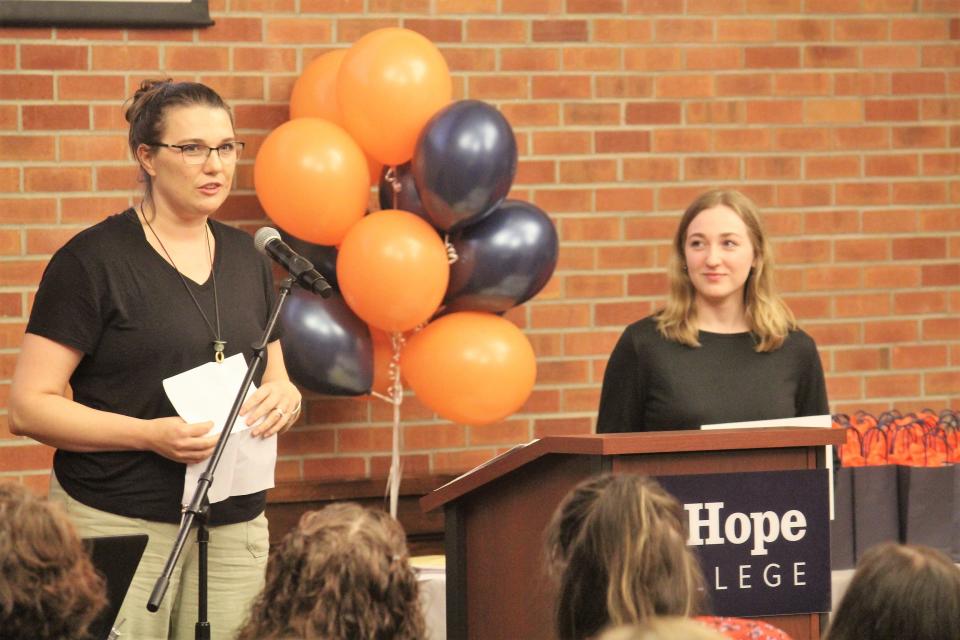 Black River teacher Ericka Foreman (left) speaks about Outstanding Student Teacher Award winner Abigail Hamilton during a celebration of Hope College education department graduates Tuesday, May 3.