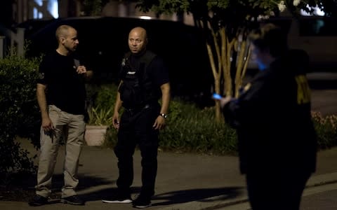 Agents with the Bureau of Alcohol, Tobacco, Firearms and Explosives stand outside the family home, in Baltimore - Credit: AP