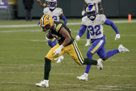 Green Bay Packers' Allen Lazard breaks away from Los Angeles Rams' Jordan Fuller (32) to score on a 58-yard touchdown run during the second half of an NFL divisional playoff football game Saturday, Jan. 16, 2021, in Green Bay, Wis. (AP Photo/Morry Gash)