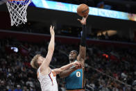 Detroit Pistons center Jalen Duren (0) shoots on Phoenix Suns center Jock Landale (11) in the second half of an NBA basketball game in Detroit, Saturday, Feb. 4, 2023. (AP Photo/Paul Sancya)