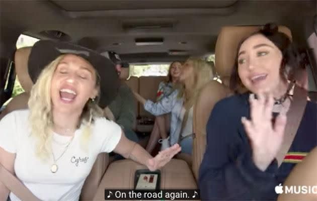 The Cyrus sisters belt out a tune. Source: YouTube/Apple Music