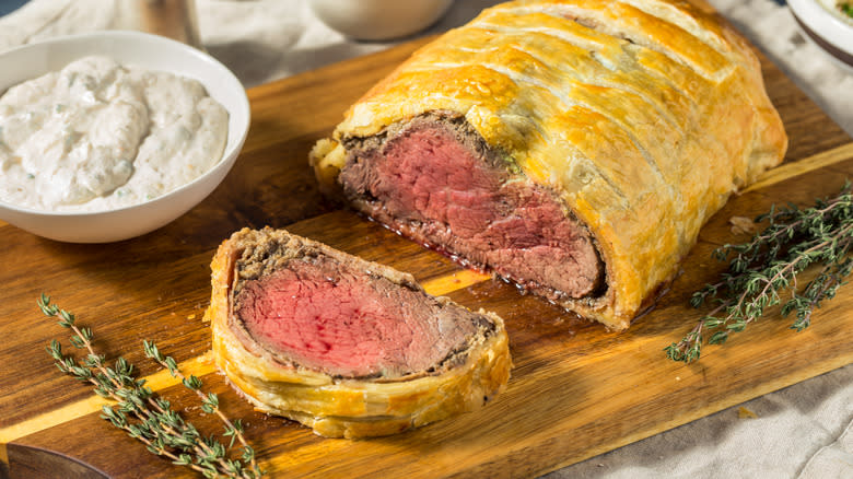 Beef Wellington on cutting board