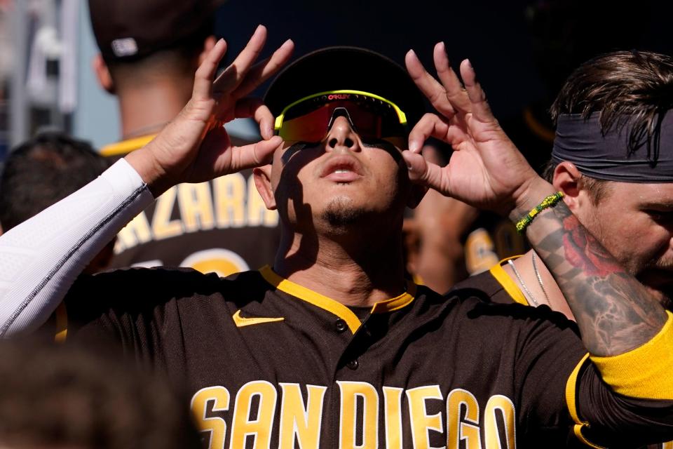 San Diego Padres' Manny Machado gestures in the dugout prior to a baseball game against the Los Angeles Dodgers Saturday, July 2, 2022, in Los Angeles. (AP Photo/Mark J. Terrill)