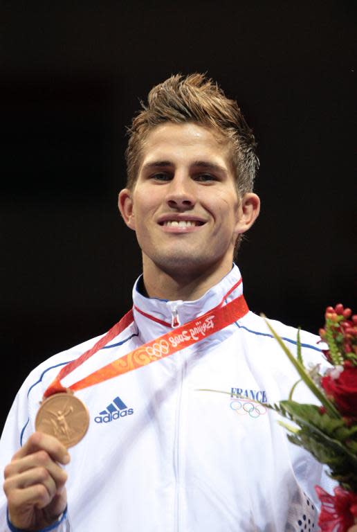 France's Alexis Vastine celebrates his bronze medal in boxing at the Beijing 2008 Olympic Games on August 23, 2008