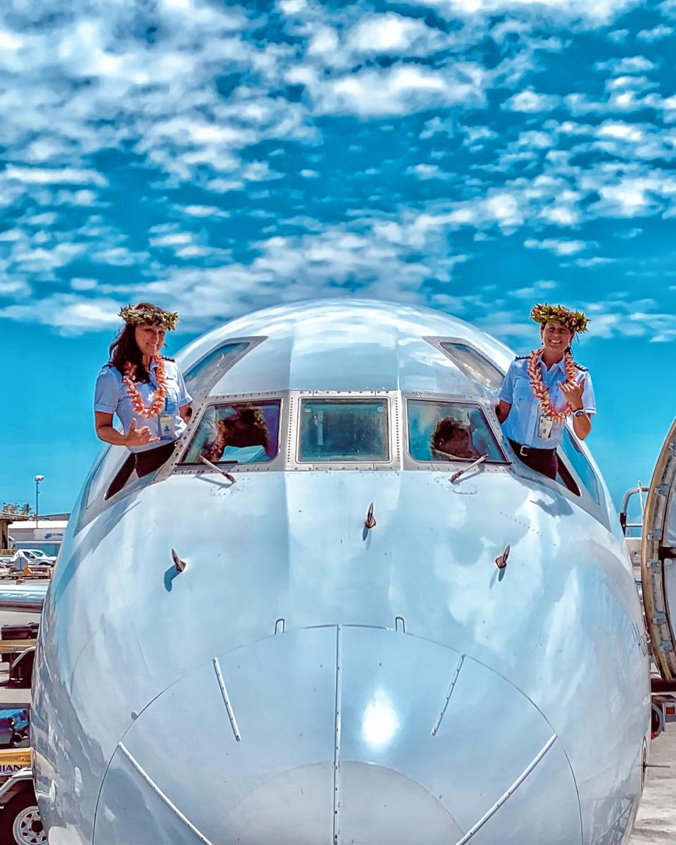 Mycynek and Mowat (left to right) flew to Tahiti together in 2019.