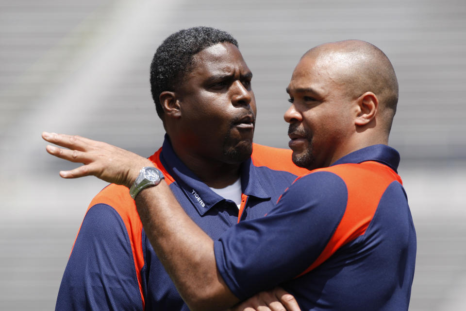 April 18, 2009; Auburn, AL, USA; Auburn Tigers defensive line coach Tracey Rocker (left) and defensive backs coach Tommy Thigpen (right) talk prior to the start of the A-Day game at Jordan-Hare Stadium in Auburn. Mandatory Credit: John Reed-USA TODAY Sports