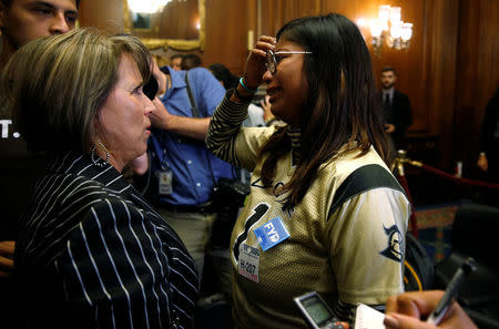 Rep. Michelle Lujan Grisham speaks with DACA recipient Karen Caudillo of Orlando, Florida, after an event by Democrats calling for Congressional Republicans to bring forward immigration legislation on Capitol Hill in Washington, U.S., September 6, 2017. REUTERS/Joshua Roberts