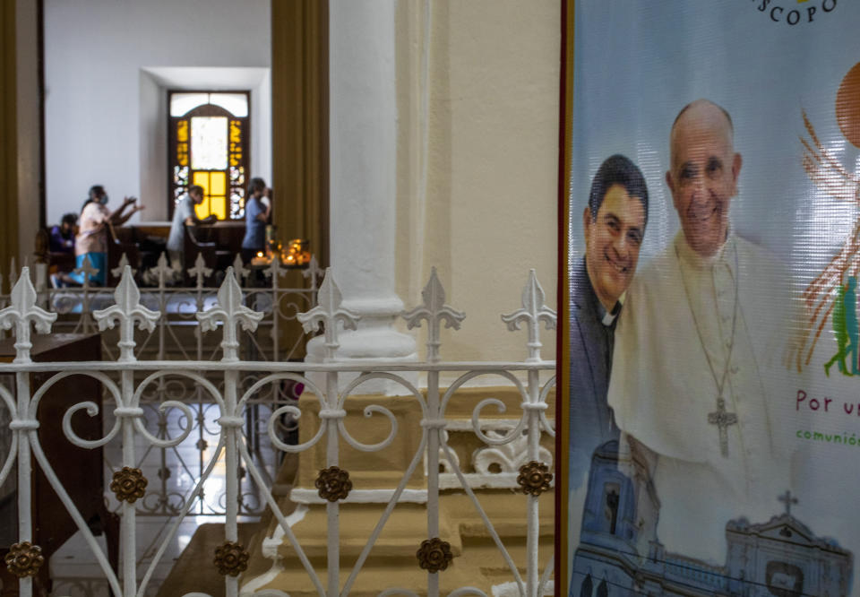 FILE - A poster featuring Bishop Rolando Alvarez and Pope Francis hangs inside the Cathedral in Matagalpa, Nicaragua, Aug. 19, 2022. Five Catholic priests were sentenced to 10 years in prison in Managua, on Monday, Feb. 6, 2023, accused of "conspiracy", including four who worked alongside the also detained bishop of the diocese of Matagalpa, Rolando Alvarez. (AP Photo/Inti Ocon, File)