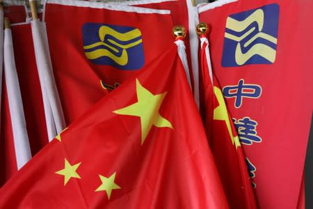 The party flag for the Chinese Unity Promotion Party and China's national flag are seen at Lin Guo-cingÕs office in Tainan