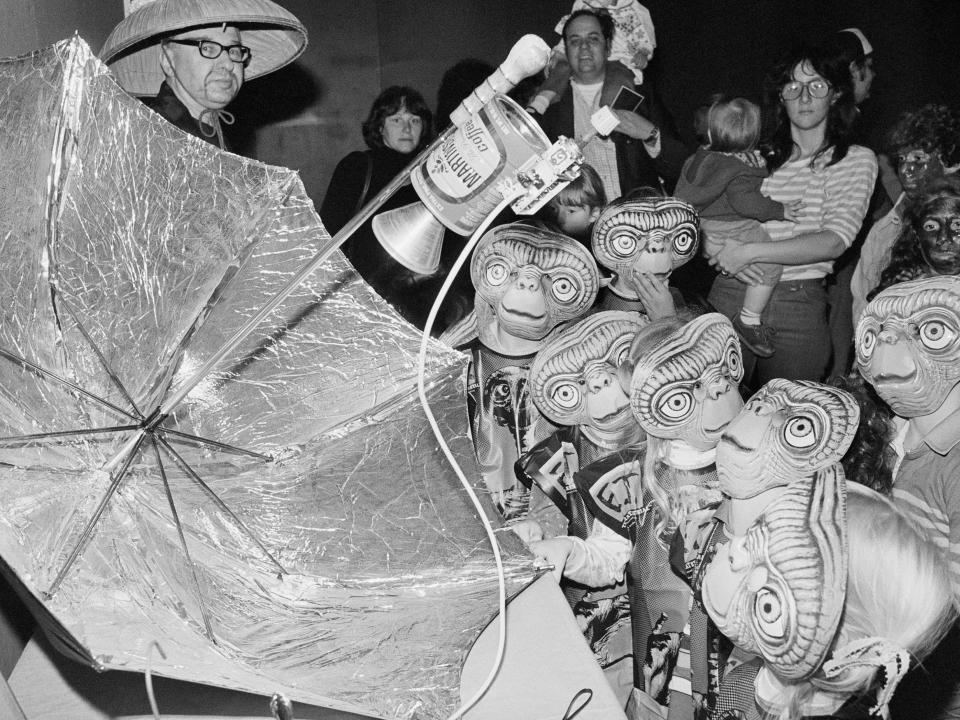 Kids wearing E. T. masks for Halloween in 1982.