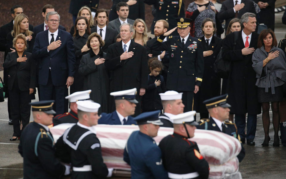 The Bush family looks on as a joint military services honor guard carries the casket for former President George H.W. Bush from the Union Pacific funeral train at Texas A&M University in College Station, Texas, Dec. 6, 2018. (Photo: Loren Elliott/Reuters)