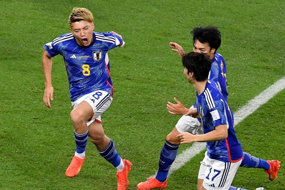 Crazy turnaround: Japan celebrate their quick-fire double to down Spain in Doha  (REUTERS)