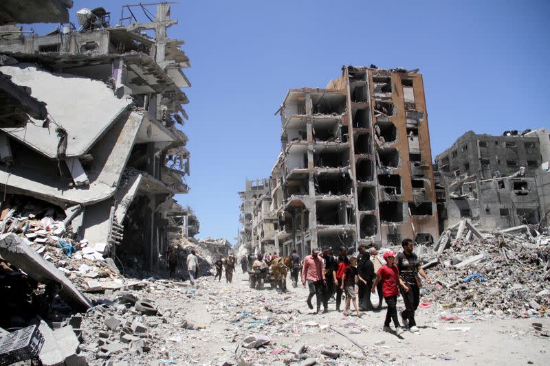 Palestinians inspect the damage after Israeli forces withdrew from Jabalia refugee camp