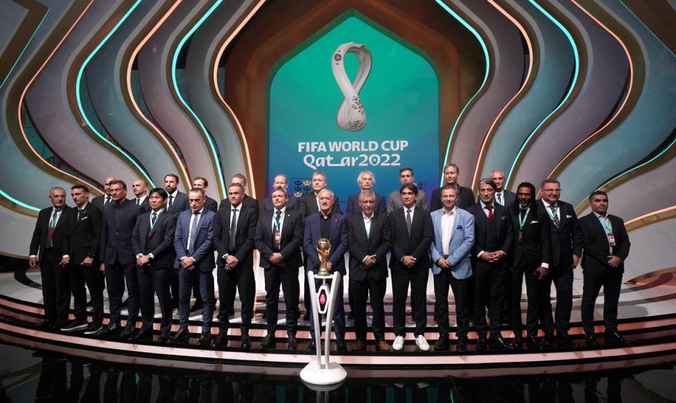 England manager Gareth Southgate (back row, third left) on stage during the World Cup Qatar 2022 draw at the Doha Exhibition and Convention Centre (Nick Potts/PA) (PA Wire)
