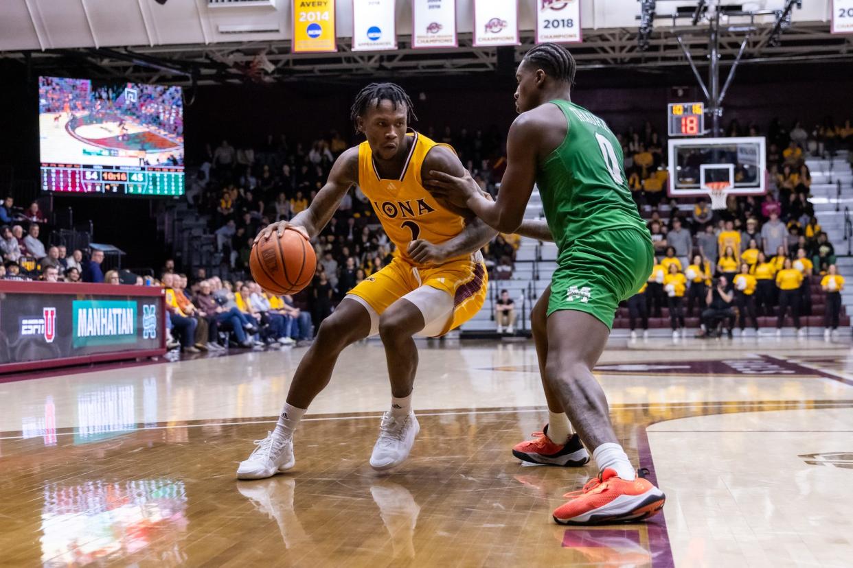 Iona's Greg Gordon backs down a defender during the Gaels' 73-63 win over Manhattan on Feb. 16, 2024.