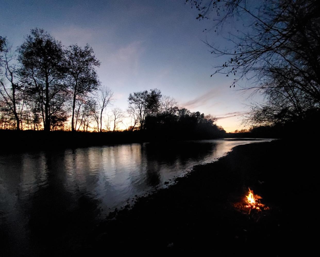 Darkness sets in at our river campsite on the final night of our three-day trip.