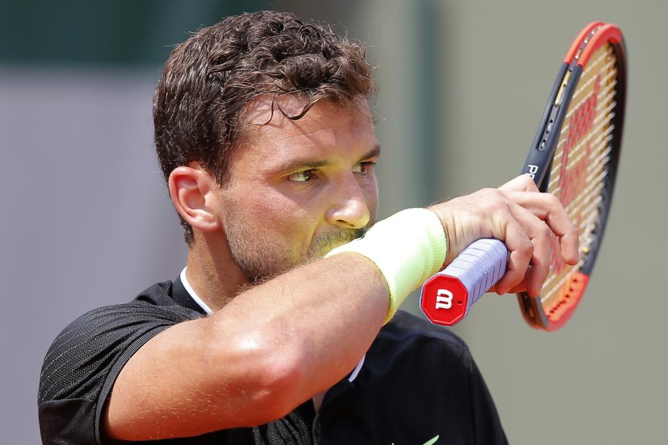 Bulgaria's Grigor Dimitrov wipes his face in his third round match against Spain's Pablo Carreno Busta at the French Open