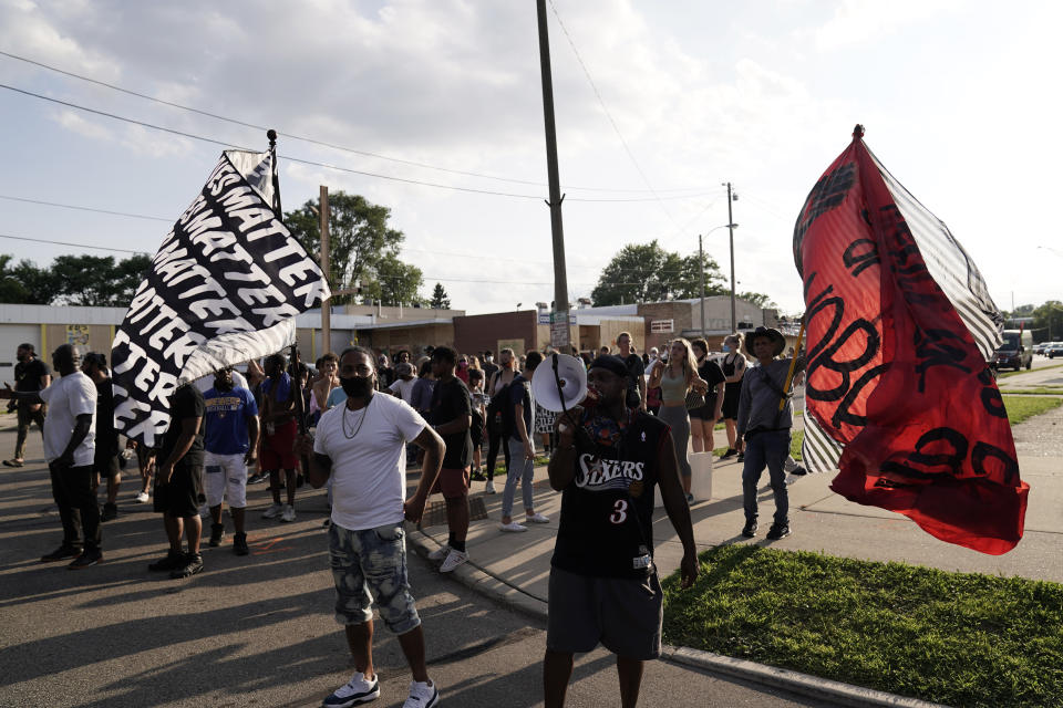 Protesters prepare to march against the Sunday police shooting of Jacob Blake Thursday, Aug. 27, 2020, in Kenosha, Wis. Until the police shooting of Blake, the bedroom community of Kenosha has been largely untouched by the level of demonstrations that had been seen in nearby Milwaukee and Chicago since the death of George Floyd.(AP Photo/Morry Gash)