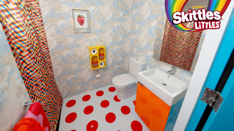 Colorful bathroom in Skittles Littles apartment, designed by Dani Klaric.