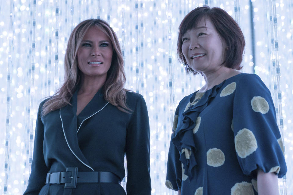 U.S. first lady Melania Trump, left, stands with Japanese Prime Minister Shinzo Abe's wife Akie Abe during a visit to a digital art museum in Tokyo Sunday, May 26, 2019. (Pierre-Emmanuel Deletree/Pool Photo via AP)