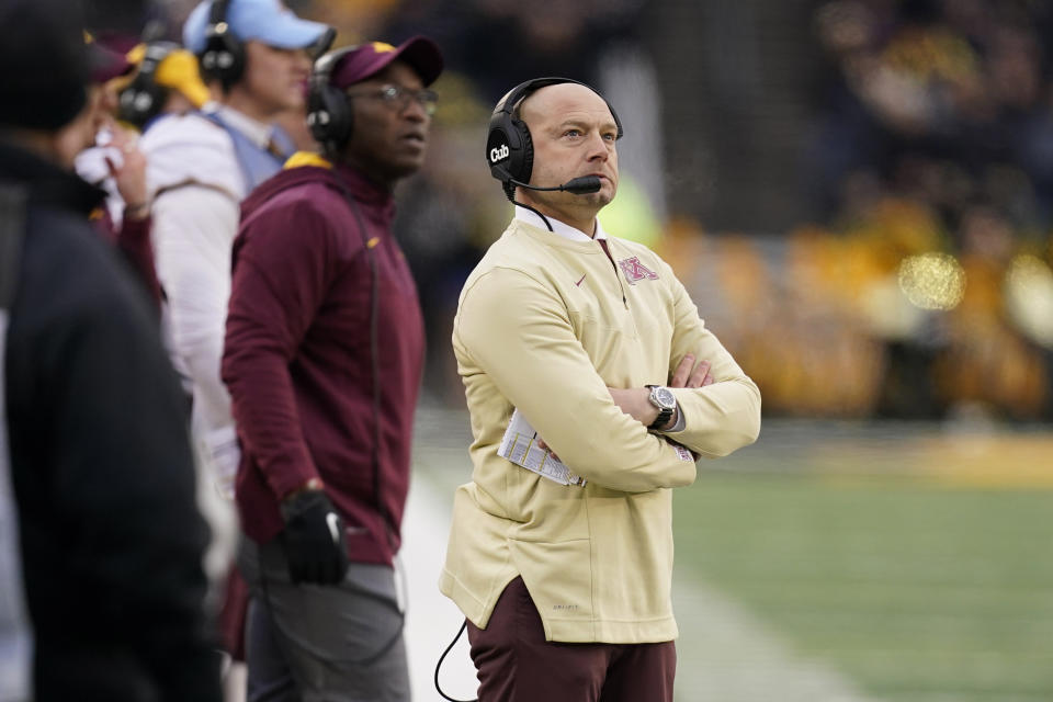 Minnesota head coach P.J. Fleck watches from the sideline during the first half of an NCAA college football game against Iowa, Saturday, Nov. 13, 2021, in Iowa City, Iowa. (AP Photo/Charlie Neibergall)