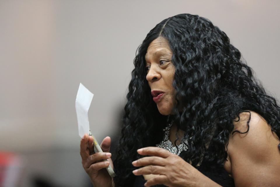 Angela Williams, founder of Mothers Against Murderers Association, brandishes a check for $1,000, donated during a Mother’s Day gala on May 11, 2024. Williams has relied on donations to sustain the nonprofit for more than two decades.