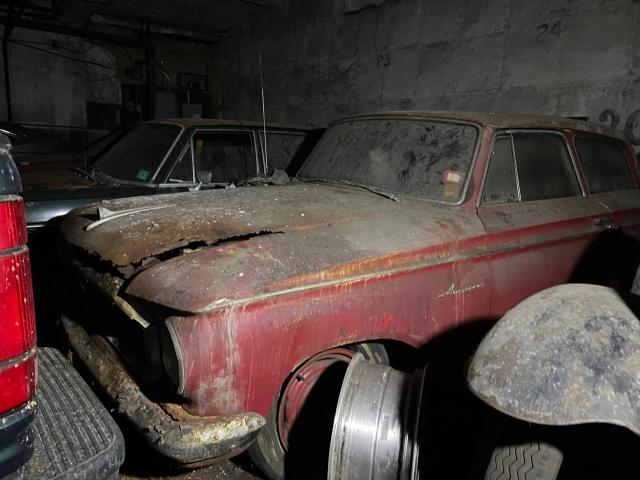 Old Car in a Garage Rug by moonfluff