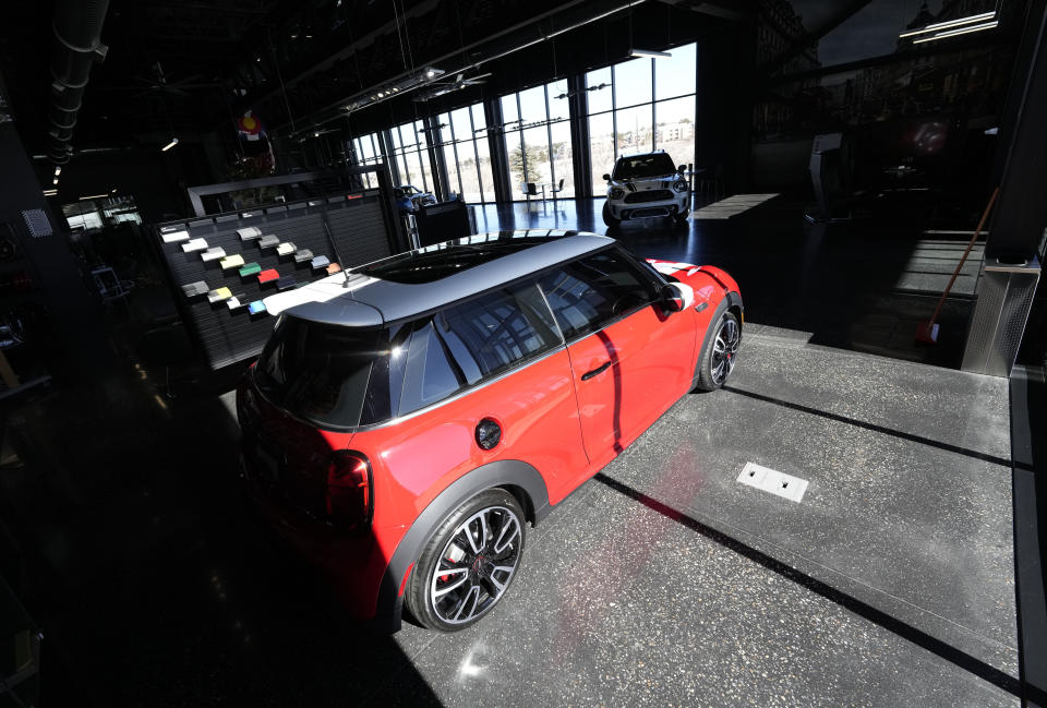 File - A 2023 Cooper S John Cooper Works hardtop sits in the light as sun streams into a Mini dealership Friday, Feb. 17, 2023, in Highlands Ranch, Colo. On Wednesday, the Labor Department reports on U.S. consumer prices for March. (AP Photo/David Zalubowski, File)