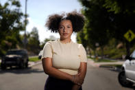 Amira Temple, a contact tracer for the COVID-19 virus, stands for a portrait Thursday, Oct. 22, 2020, in Chula Vista, Calif. Temple sees her job as an extension of her work as a civil rights activist in San Diego's Black and Hispanic communities. "There's a gap within these communities of food, housing and security so COVID is kind of bringing these things to light," she said. (AP Photo/Gregory Bull)