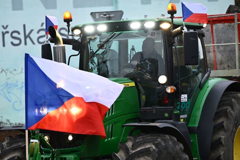 Farmers steer their tractors onto a road during a protest as they demand better conditions to grow, produce and maintain a proper income. Petrášek Radek/CTK/dpa