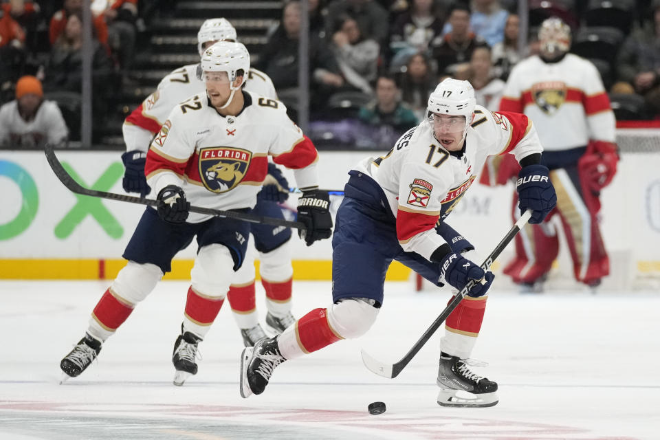 Florida Panthers center Evan Rodrigues (17) controls the puck during the second period of an NHL hockey game against the Anaheim Ducks in Anaheim, Calif., Friday, Nov. 17, 2023. (AP Photo/Ashley Landis)