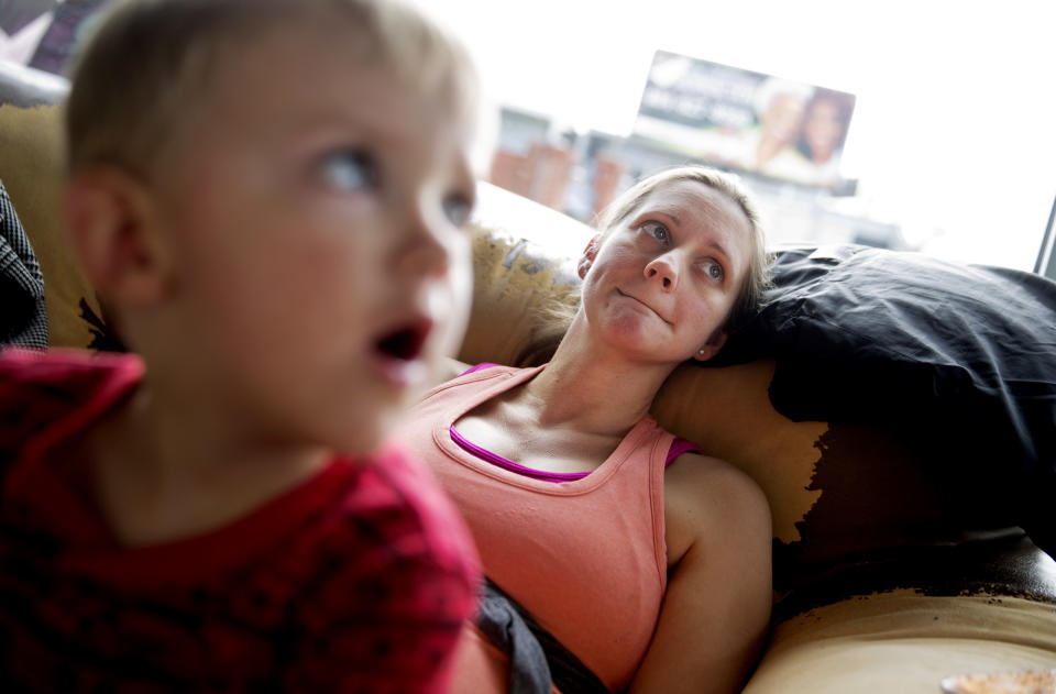 Jessica Greene, 37, sits with her son, Woods, 2, at a coffee shop in East Atlanta, Ga., in Dekalb County, Thursday, Jan. 5, 2017. Greene, who voted for Clinton, countered that what Donald Trump supporters see as refreshing moxie amounts to "egomaniacal ... control issues" that leave her "leery" and "in a very dark place about it all." (AP Photo/David Goldman)