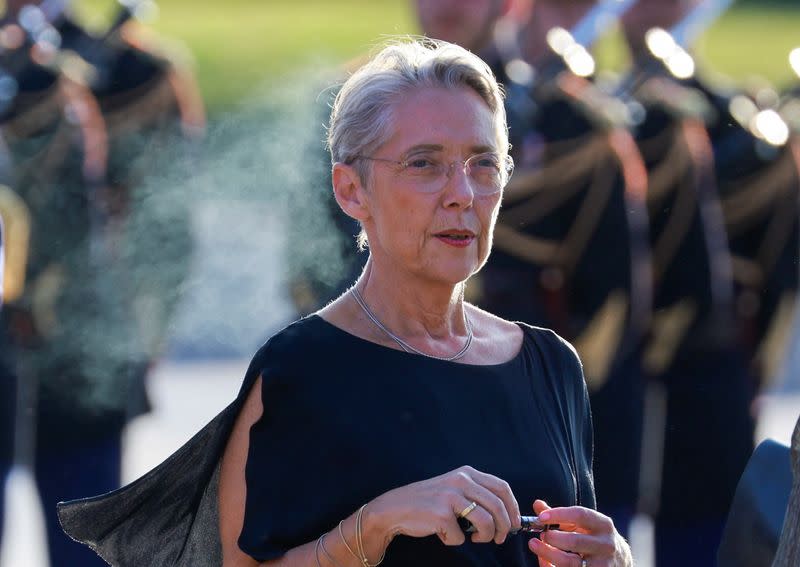 French Prime Minister Elisabeth Borne arrives at a dinner held at the Louvre in Paris