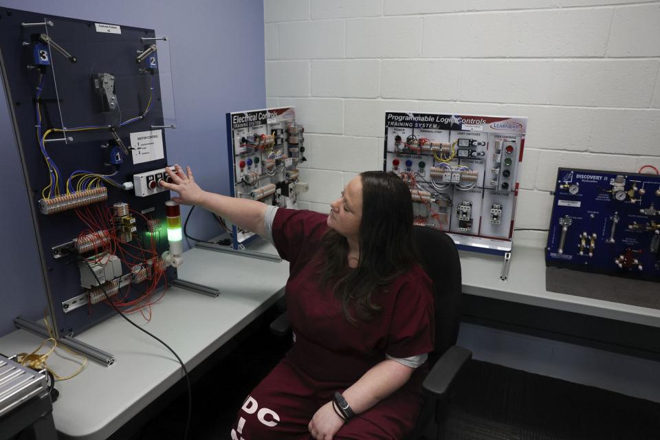 Miranda Jones works on a control trainer in the automation and robotics classroom at the Utah State Correctional Facility in Salt Lake City on Friday. The Utah State Correctional Facility and Davis Technical College have partnered to bring three new certification programs to female prisoners through expanded equal opportunity education legislation.