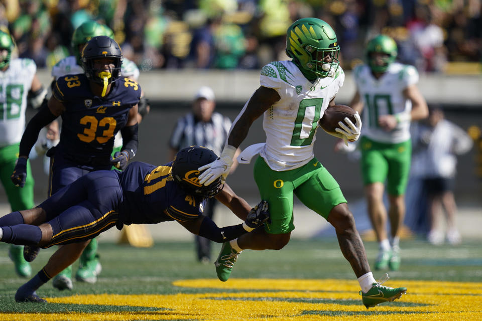 FILE - California cornerback Isaiah Young (41) is unable to tackle Oregon running back Bucky Irving (0) during the first half of an NCAA college football game in Berkeley, Calif., Saturday, Oct. 29, 2022. Oregon opens their season at home against Portland State on Sept. 2.(AP Photo/Godofredo A. Vásquez, File)