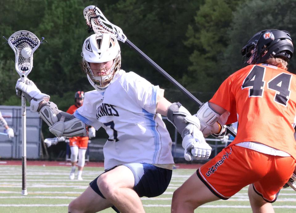 East Bridgewater's Jake Shaw cradles the ball against Middleboro Ryan Delancey during a game on Tuesday, May 17, 2022.    