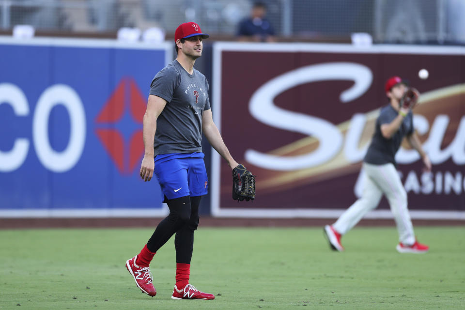 Philadelphia Phillies relief pitcher Mark Appel walks in the outfield before the team's baseball game against the San Diego Padres, Saturday, June 25, 2022, in San Diego. Appel, the 2013 No. 1 overall draft pick, received his first major league call-up Saturday at the age of 30. (AP Photo/Derrick Tuskan)