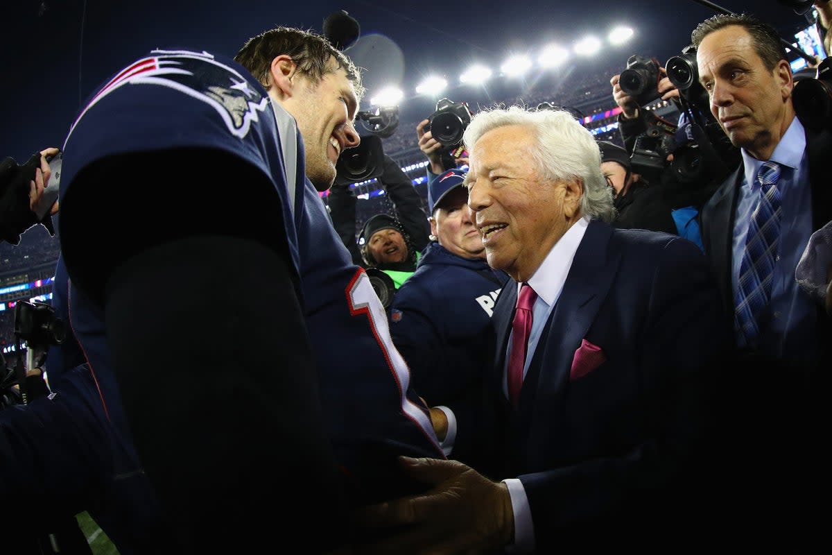 Tom Brady celebrates with Patriots owner Robert Kraft after winning the AFC Championship Game against the Jacksonville Jaguars at Gillette Stadium on 21 January 2018 (Getty Images)