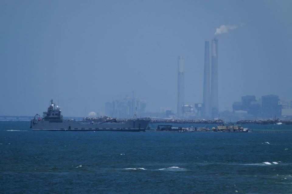 A ship is seen off the coast of Gaza near a US-built floating pier that will be used to facilitate aid deliveries, as seen from the central Gaza Strip, (AP)