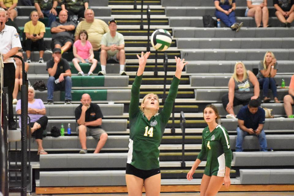 Monrovia's Shelby Clements sets the ball during the Bulldogs' matchup with Martinsville on Aug. 25, 2022