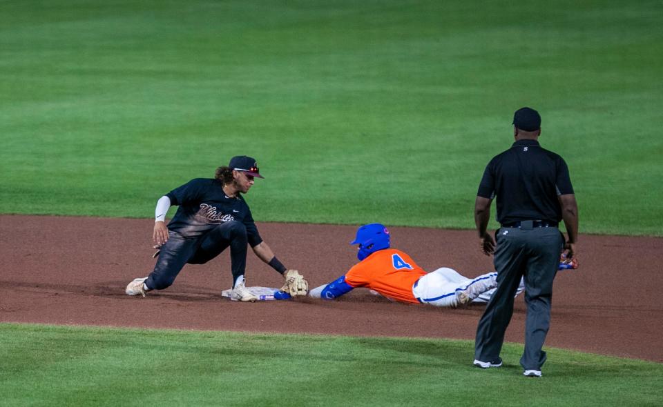 Florida's outfielder Jud Fabian (4) is initially called safe at second under Bethune-Cookman's Matthew Garcia’s tag (4) in the bottom of the sixth inning Tuesday, May 10, 2022, at Condron Family Ballpark in Gainesville, Florida. The call would be overturned  and Fabian called out.